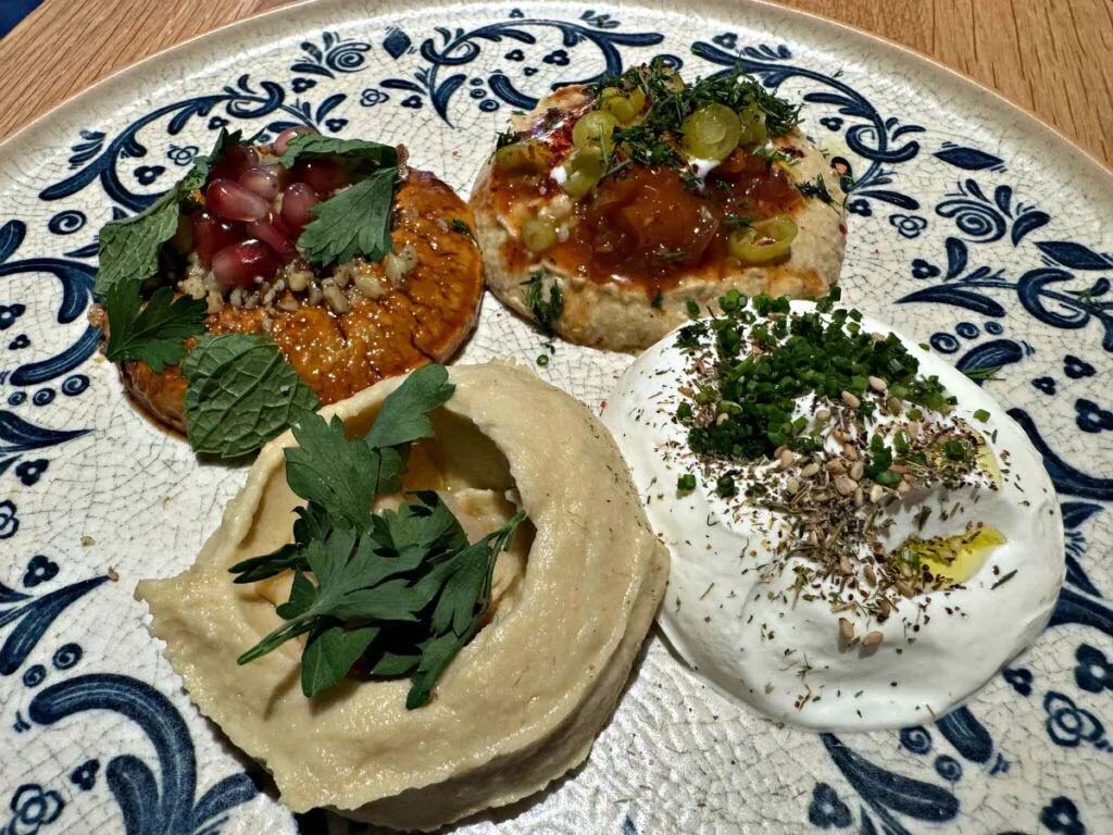 Clio’s four dips — hummus, muhammara, labneh and baba ganoush — can be ordered individually or as a quartet with a side of house made pita or crudites.<br />(Sarah Baker Hansen / Flatwater Free Press)