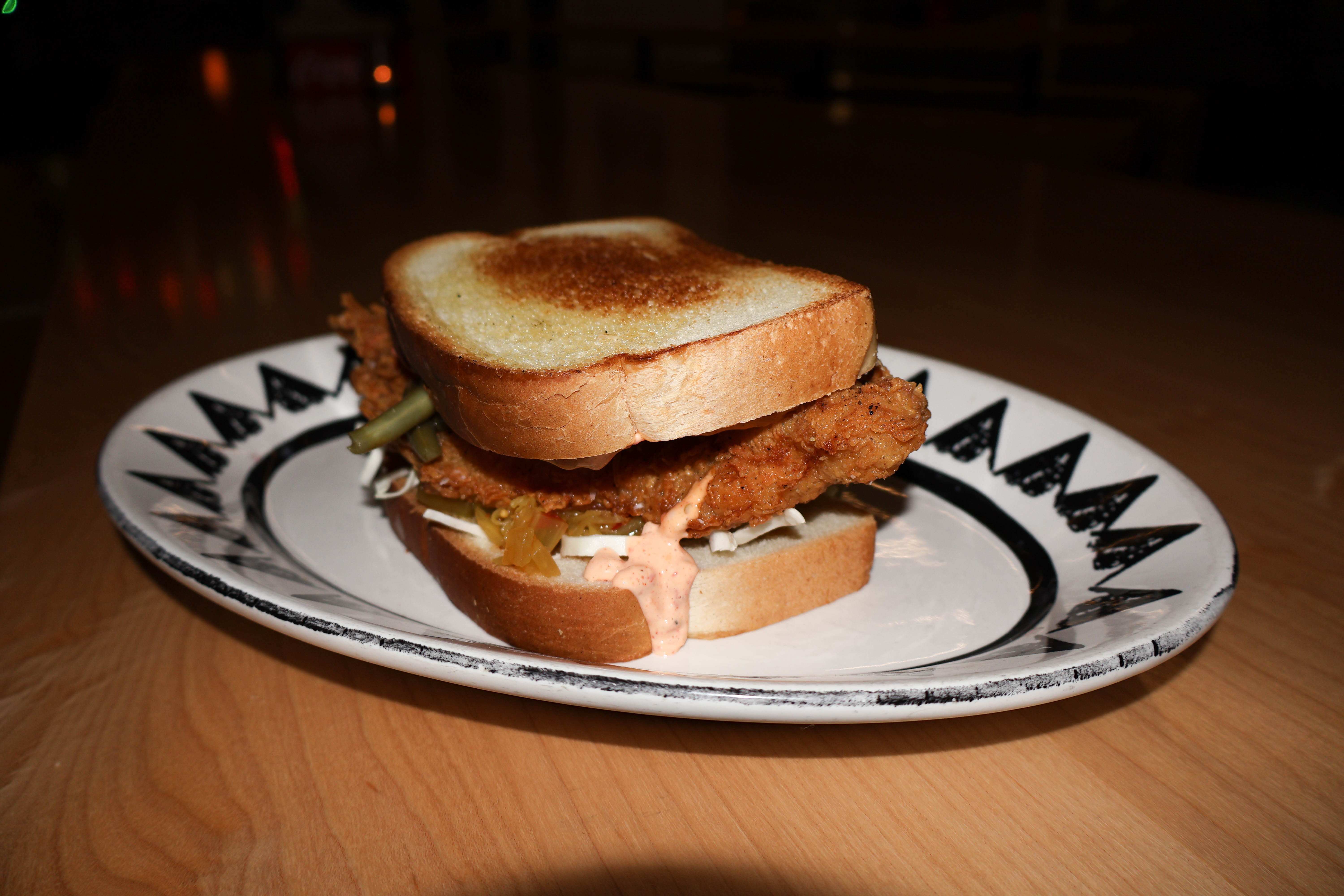 Pictured is the fried Catfish Sandwich with a rouille sauce and scratch pickles. (Josie Charron / The Daily Record)