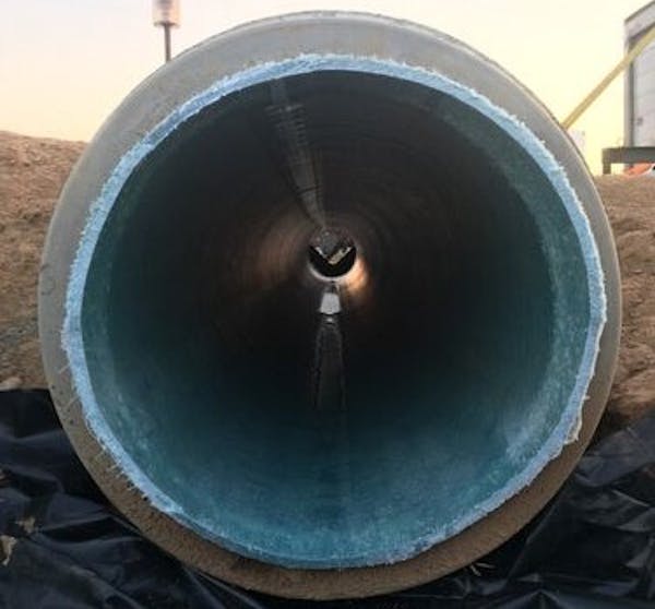 The blue cured-in-place pipe, or CIPP, can be seen inside this damaged storm sewer pipe. The CIPP was created by steam cooking the resin into the hard plastic. (Andrew Whelton / Purdue University)