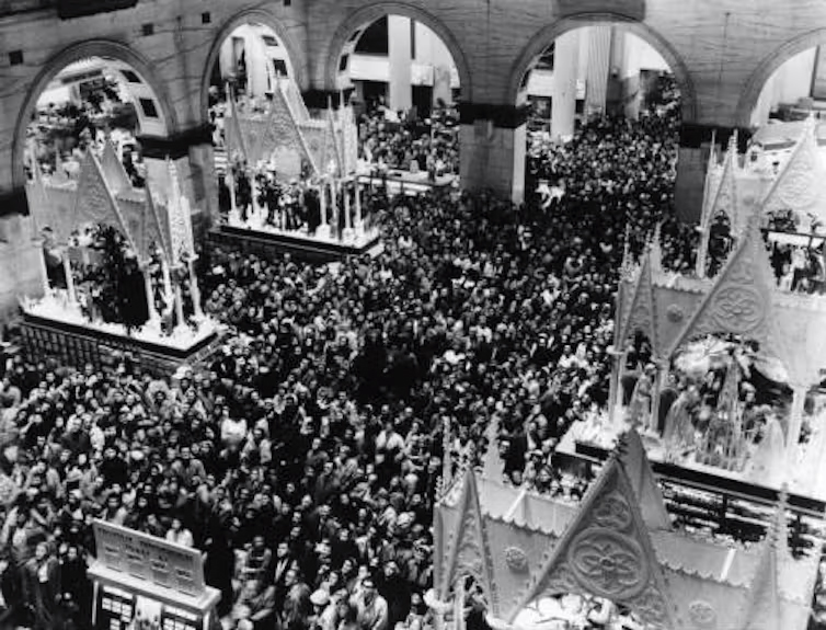 Christmas shoppers gather to watch the holiday season display at Wanamaker’s in December 1973.<br />(Courtesy of the Special Collections Research Center, Temple University Libraries, Philadelphia, PA / The Conversation)