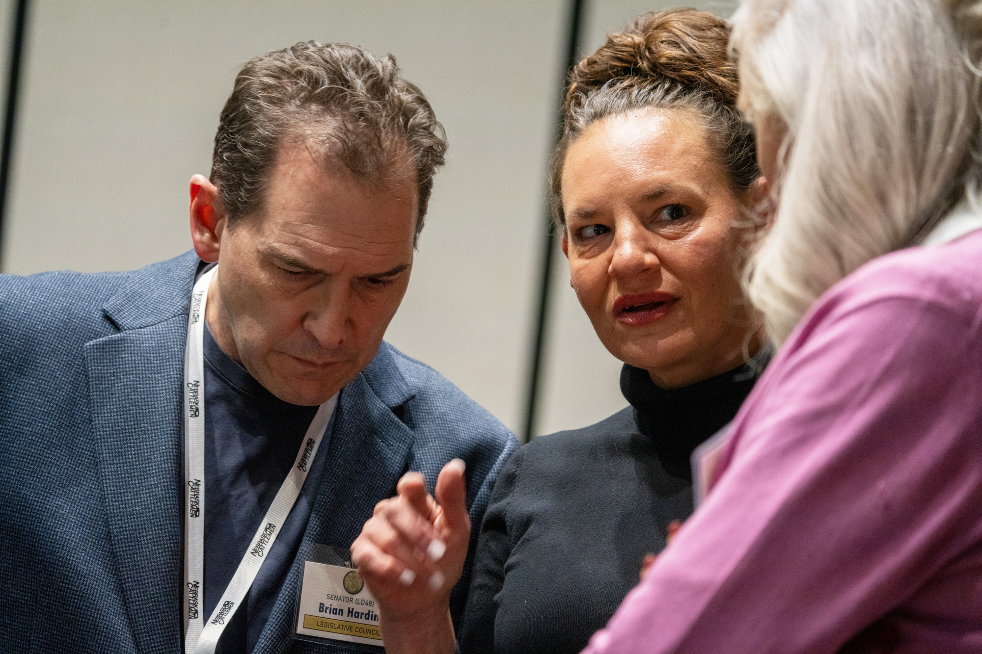 State Sen. Danielle Conrad of Lincoln (center) talks with State Sen. Brian Hardin of Gering (left) and State Sen.-elect Tanya Storer of Whitman at a legislative retreat in Kearney on Friday, Dec. 13, 2024.<br />(Zach Wendling / Nebraska Examiner)