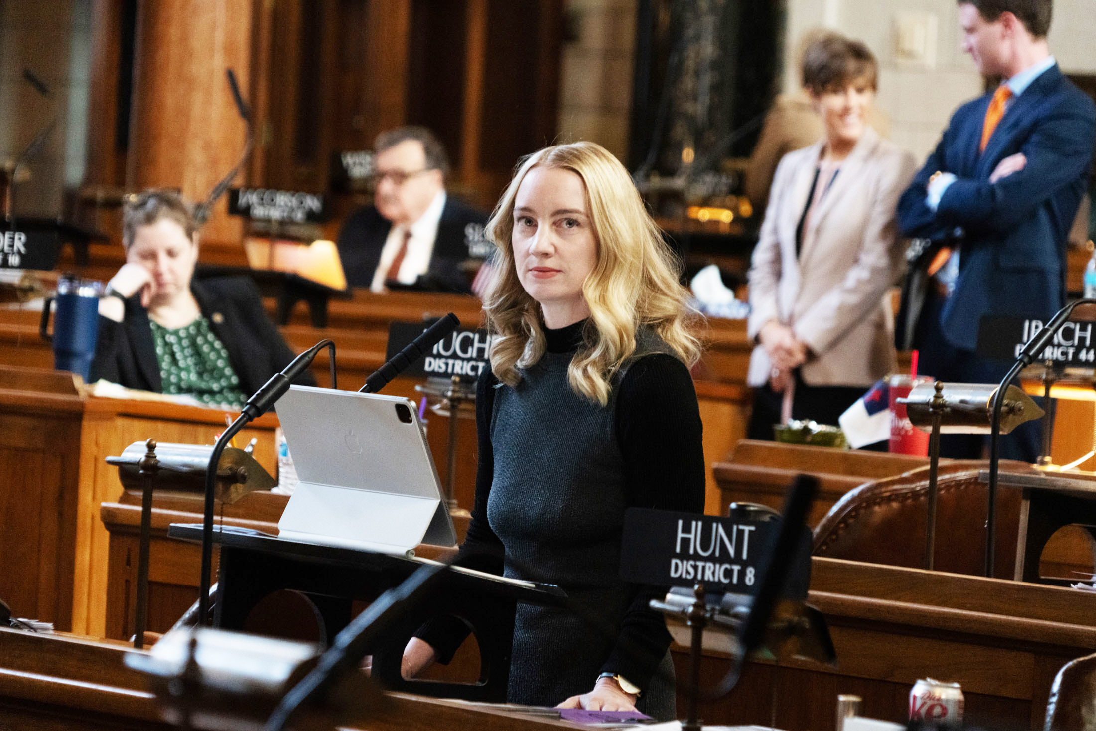 State Sen. Megan Hunt of Omaha glances at the speaking queue during debate.<br />(Zach Wendling / Nebraska Examiner)