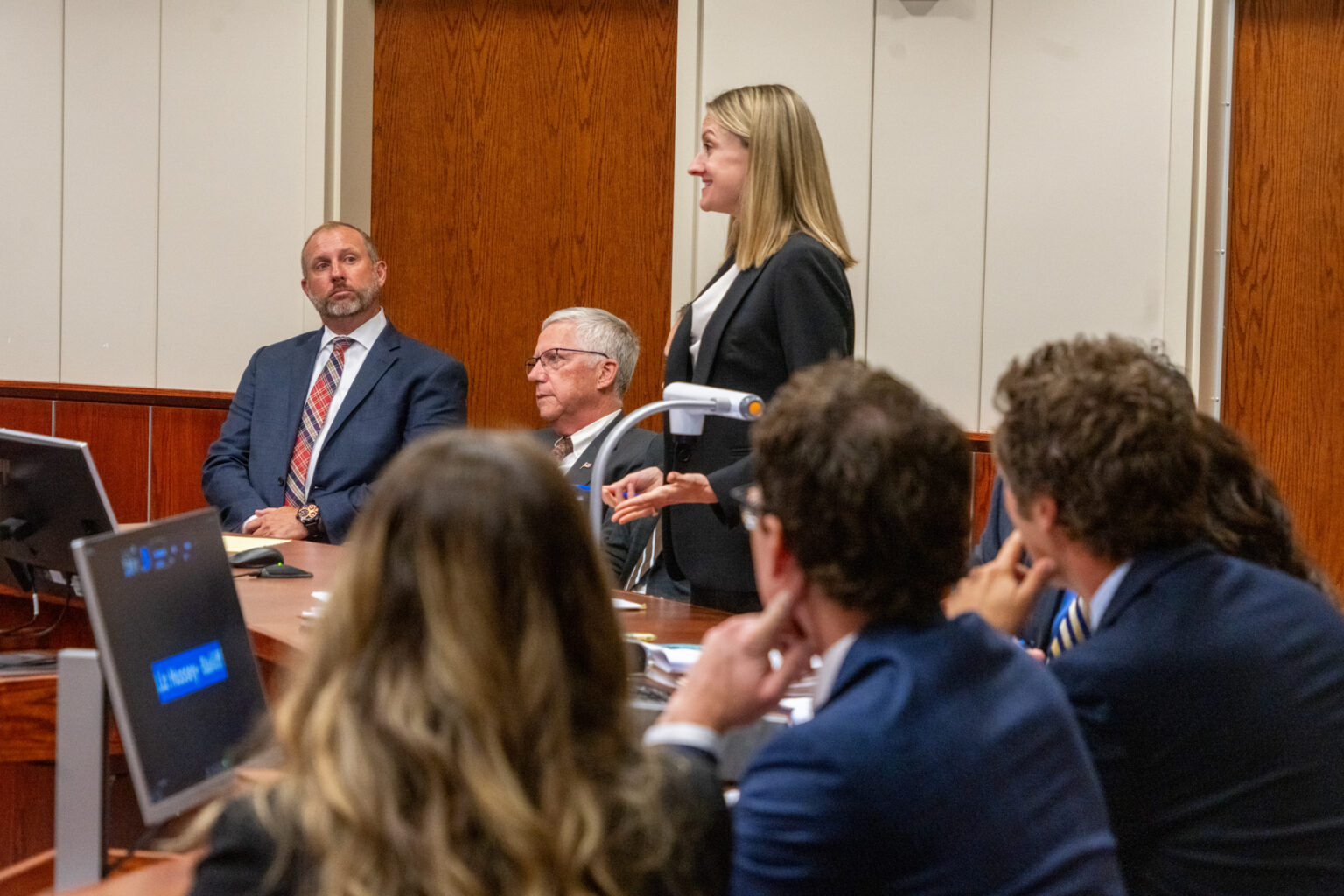 John Kuehn of Heartwell (left) looks toward his Austin-based attorney, Anne Marie Mackin, at the start of official court proceedings in Lancaster County District Court that could determine the fate of two 2024 ballot measures on medical cannabis, Sept. 20, 2024.<br />(Zach Wendling / Nebraska Examiner)