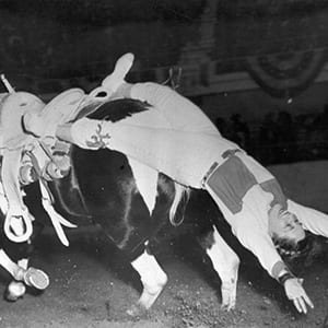 Tad Lucas doing a trick called the “back drag.”<br />(Courtesy of the National Cowboy &amp; Western Heritage Museum)