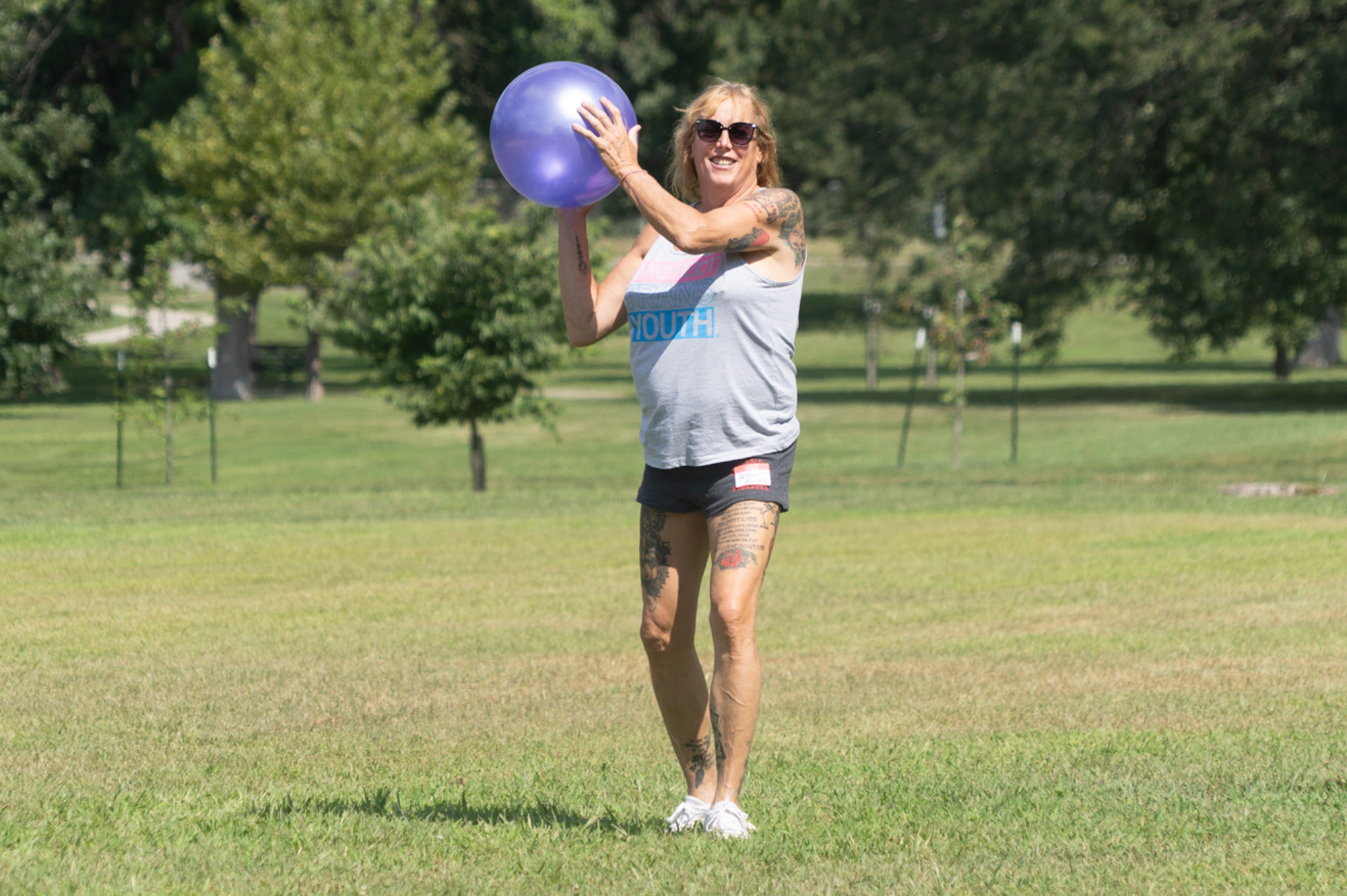 Jessie McGrath of Omaha throws a kickball during a queer field day on Sunday, Aug. 27, 2023, in Omaha, Neb.<br />(Zach Wendling / Nebraska Examiner)