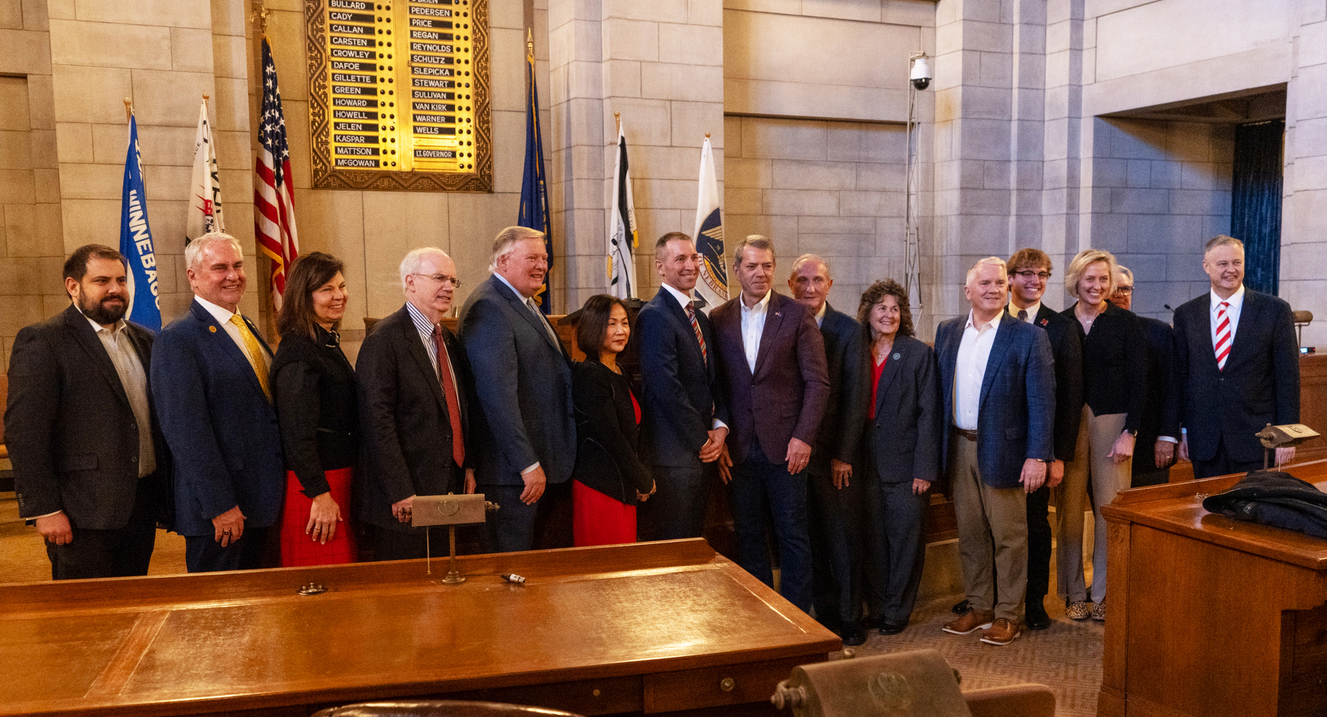 University of Nebraska regents, chancellors and interim NU President Chris Kabourek join with state senators and Nebraska Gov. Jim Pillen following the announcement of a new scholarship for top-performing Nebraska students to the University of Nebraska, Feb. 5, 2024.<br />(Zach Wendling / Nebraska Examiner)