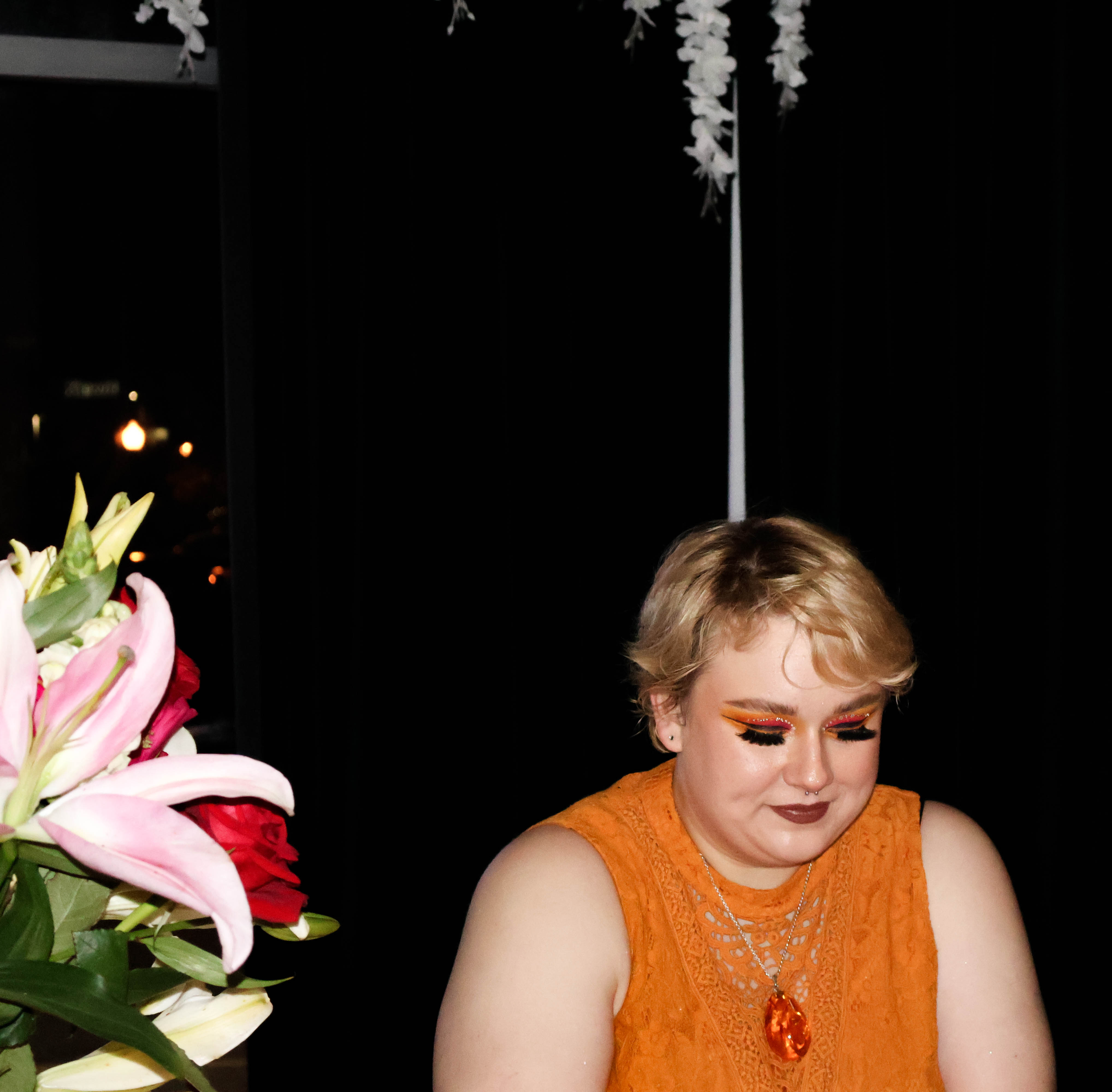 Makeup artist, Rachel Turman, winds down after a busy evening of bringing the designer’s makeup looks to life. (Josie Charron / The Daily Record)