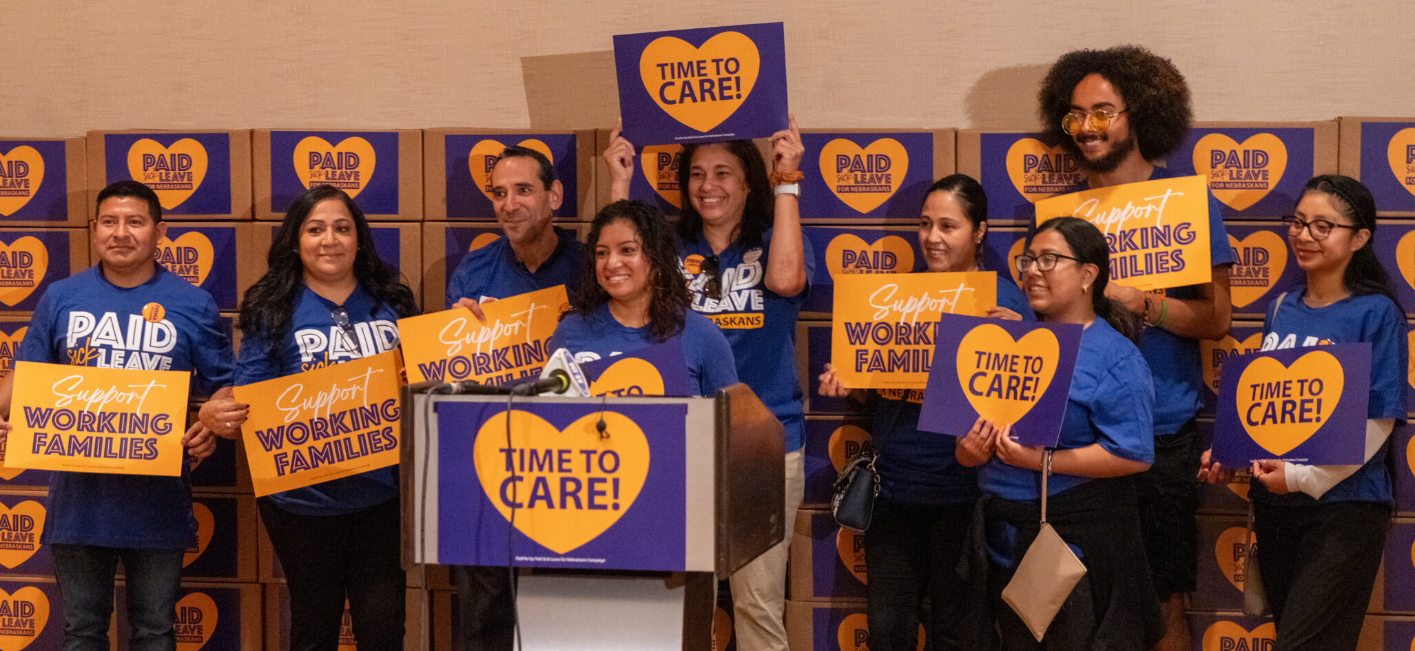 Advocates to enshrine a minimum level of paid sick leave for Nebraska workers in state law celebrate the announcement they gathered more than 138,000 signatures.<br />(Zach Wendling / Nebraska Examiner)