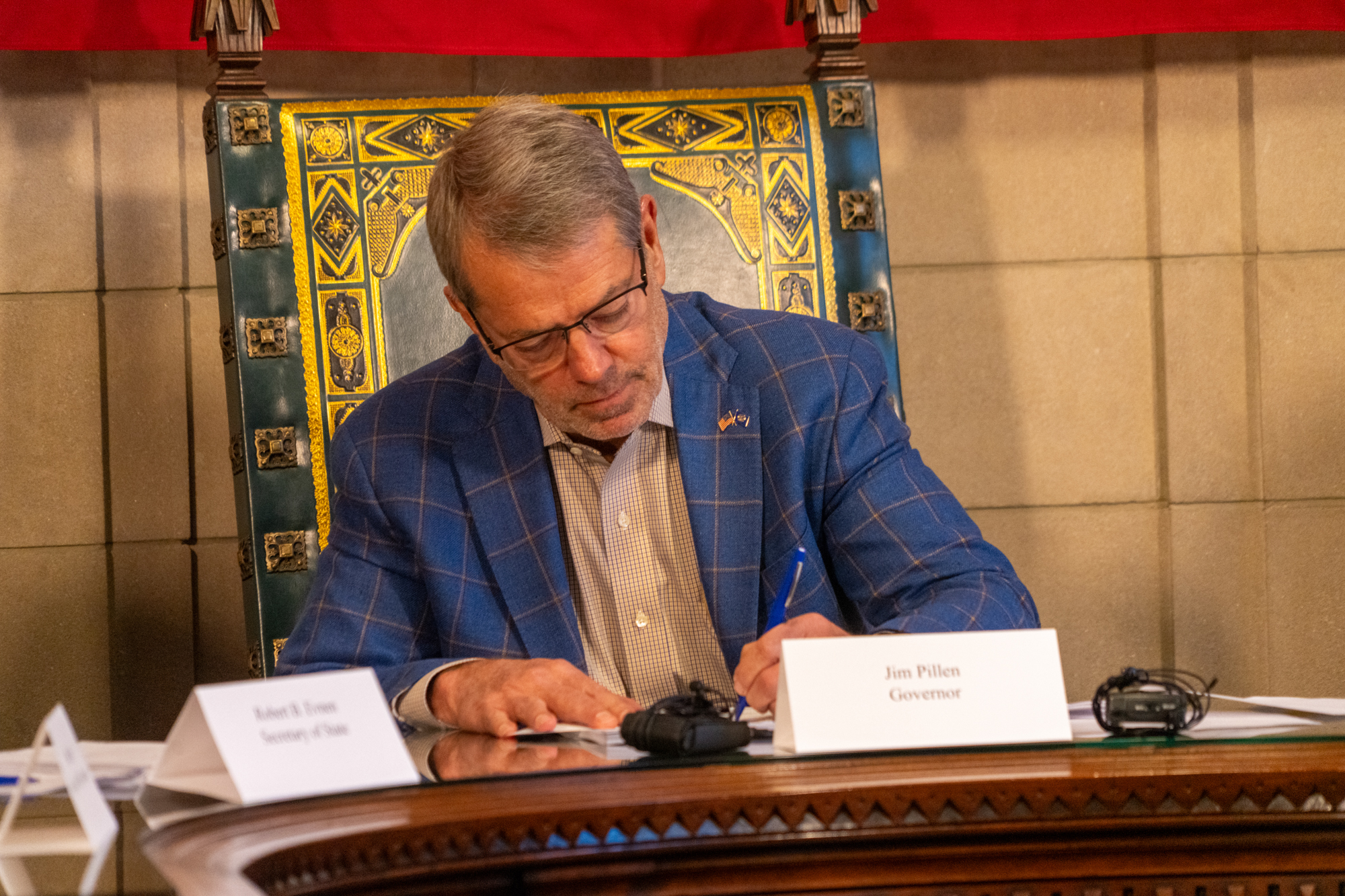 Nebraska Gov. Jim Pillen signs off on the 2024 general election results on Monday, Dec. 2, 2024.<br />(Zach Wendling / Nebraska Examiner)