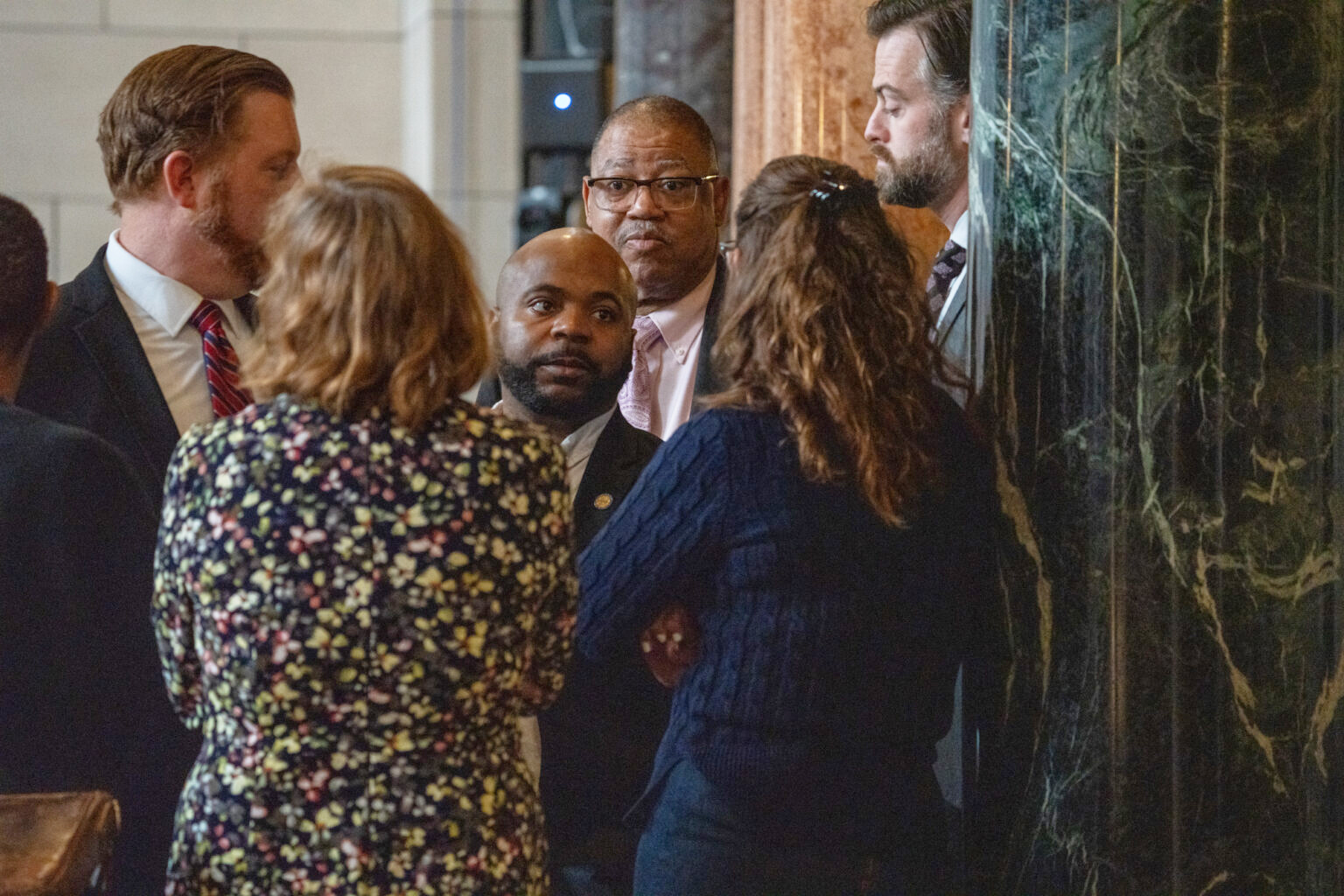 State Sens. from left: John Cavanaugh of Omaha, Machaela Cavanaugh of Omaha, Terrell McKinney of Omaha, Victor Rountree of Bellevue, Danielle Conrad of Lincoln and George Dungan of Lincoln meet off the floor of the Legislature, March 26, 2025.<br />(Zach Wendling / Nebraska Examiner)