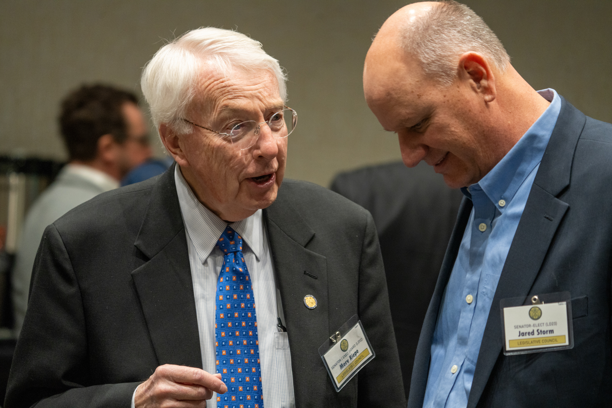 State Sen. Merv Riepe of Ralston (left) talks with State Sen. Jared Storm of David City on Dec. 13, 2024.<br />(Zach Wendling / Nebraska Examiner)