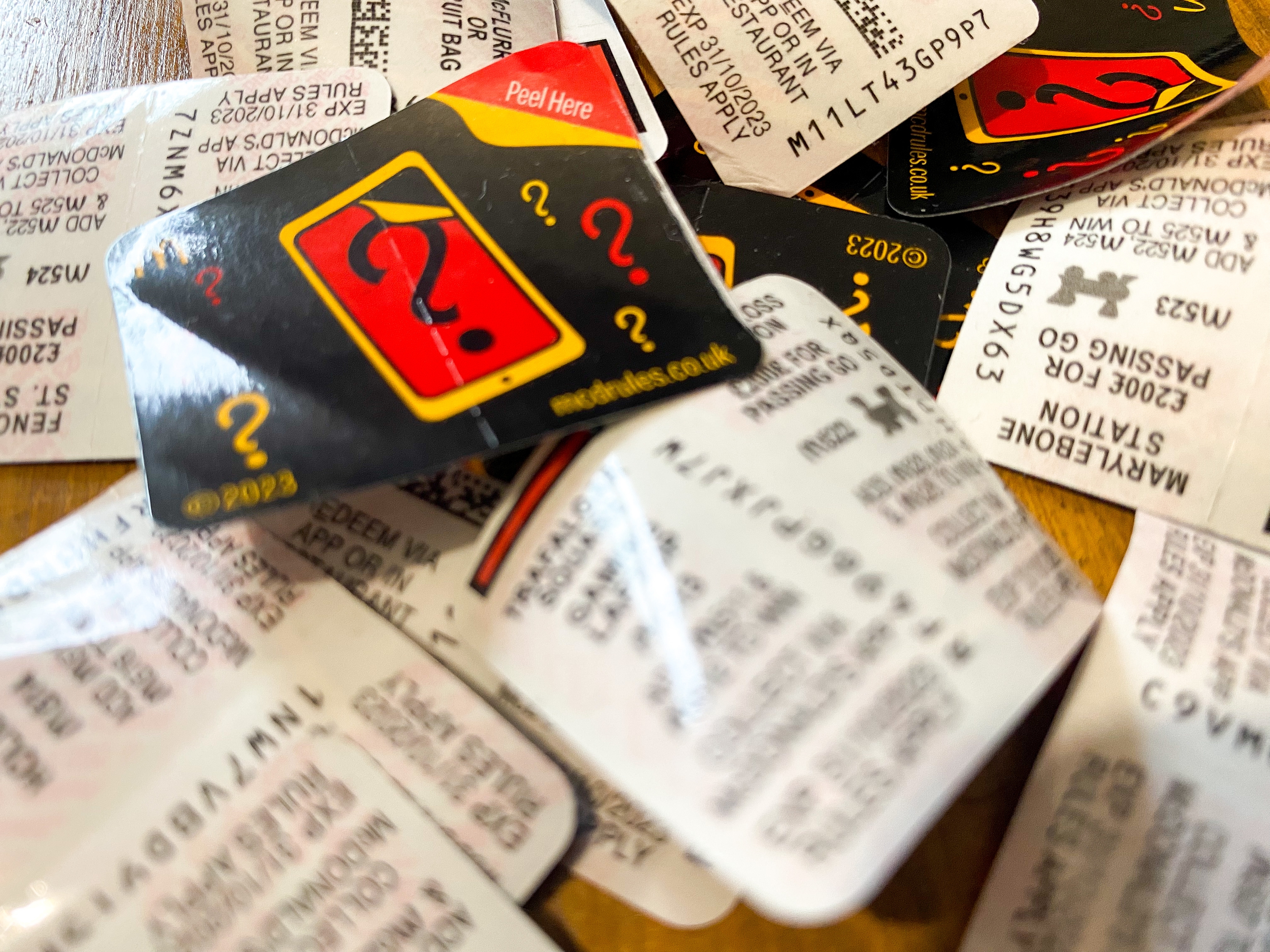 A pile of Monopoly game tickets taken off McDonald&#039;s food packaging.<br />(Shutterstock)