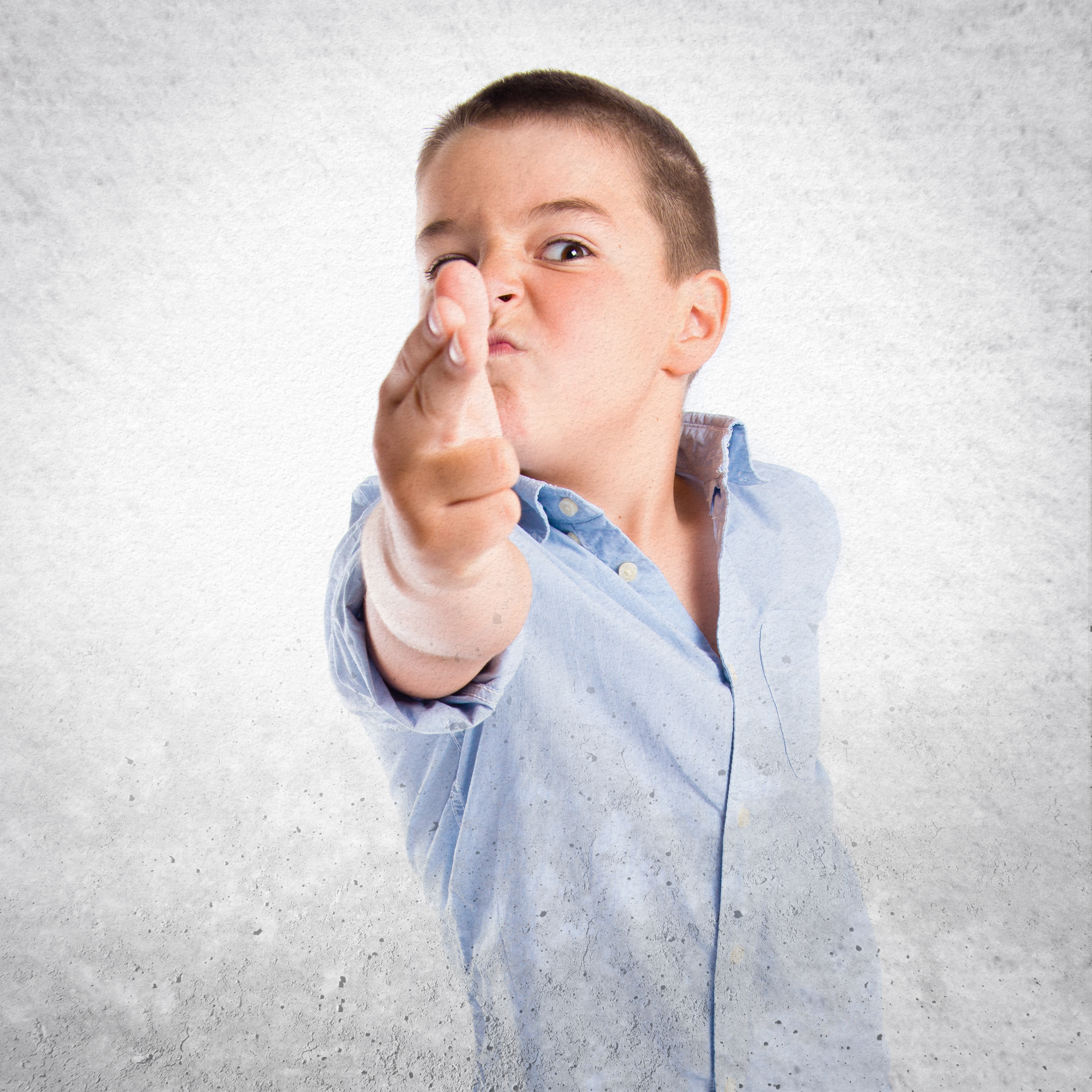 Kid doing a finger gun gesture.<br />(Shutterstock)