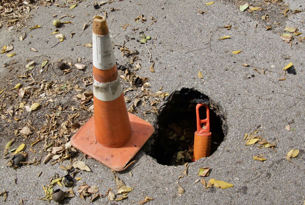 Leaders with the Fontenelle Hills Tenants Union have called on their landlord, Elevate Living, to fix potholes dotting the apartment complex’s parking lots.<br />(Jeremy Turley / Flatwater Free Press)