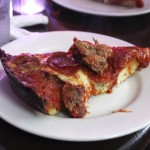 A slice of deep-dish pizza is shown at Pequod's in Chicago Sept. 5, 2014. Chicago is one of a handful of cities across the country, like Boston, Milwaukee and New York, with companies that offer tours of the local pizza scene.
 (Caryn Rousseau / AP Photo)