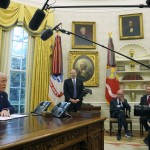 President Donald Trump (from left) speaks while signing an executive order as Commerce Secretary nominee Howard Lutnick, Rupert Murdoch and Larry Ellison, chairman and chief technology officer of Oracle Corporation, listen in the Oval Office of the White House, Monday, Feb. 3, 2025, in Washington. 
(Evan Vucci / AP Photo)
