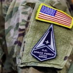 A solider wears a U.S. Space Force uniform during a ceremony for U.S. Air Force airmen transitioning to U.S. Space Force guardian designations at Travis Air Force Base, Calif., Feb. 12, 2021. 
(Noah Berger / AP Photo)