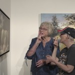 Janith Farnham signs "water" while she and her daughter, Jacque, look at an artwork of a waterfall at the Visual Arts Center at the Washington Pavilion in Sioux Falls, S.D., on May 20, 2025. 
(Shelby Lum / AP Photo)