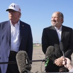 President Donald Trump (left) listens as Commerce Secretary Howard Lutnick speaks with reporters before boarding Air Force One at Morristown Municipal Airport in Morristown, N.J., Sunday, July 6, 2025, en route to Washington. 
(Jacquelyn Martin / AP Photo)