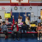 Children raise their hands while participating in activities during the East Providence Boys and Girls Club Summer Camp at Emma G. Whiteknact Elementary School on Thursday, July 10, 2025, in Providence R.I. 
(Sophie Park / AP Photo)
