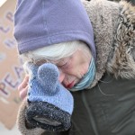 A protester covers their eyes after confronting law enforcement outside the Bishop Henry Whipple Federal Building, Thursday, Jan. 8, 2026, in Minneapolis, Minn.
(Tom Baker / AP Photo)