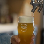 Beer froths after Boston Beer Co. Founder and CEO Jim Koch poured himself a drink at his company headquarters in Boston, Tuesday, July 7, 2026. 
(Rodrique Ngowi / AP Photo)