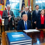 President Donald Trump winks as the members of the media depart the Oval Office of the White House as Essar Capital Director Prashant Ruia, from left: Energy Secretary Chris Wright, Commerce Secretary Howard Lutnick, John Jovanovic, chairman of the Export-Import Bank of the United States, Iowa Attorney General Brenna Bird, Mariannette Miller-Meeks, R-Iowa., and Rep. Ashley Hinson, R-Iowa, look on, Monday, Sept. 28, 2026, in Washington.
(Alex Brandon / AP Photo)