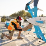 An Amazon employee loads a package into one of the company’s delivery drones. The drones are able to carry packages weighing 5 pounds or less up to 7.5 miles away from their launch site.
(Photo courtesy of Amazon via Flatwater Free Press)