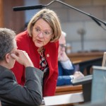 State Sen. Jane Raybould of Lincoln talks with state Sen. Stan Clouse of Kearney before debate on her priority bill to amend voter-approved annual increases to the state’s minimum wage, March 31, 2025.
(Zach Wendling / Nebraska Examiner)