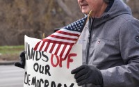 Some of the many signs held by protestors at Memorial Park in Omaha, Nebraska on April 5th for the “hands off” rally.
(Carla Chance / The Daily Record)