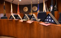 Graduates receive a personalized Veterans Treatment Court graduation certificate, a personalized flag in a triangle box, and their own, personalized graduation dog tag, engraved with “Honor Restored,” the program’s motto. (Carla Chance / The Daily Record)