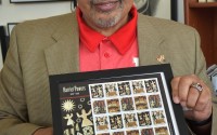 Eric L Ewing, Executive Director of the Great Plains Black History Museum, holds U.S. commemorative stamps of quilts, made by Harriet Powers, a renowned American folk artist and quilter born into slavery. Celebrated for her "story quilts," using appliqué techniques to depict Bible stories, her famous works are housed at the Smithsonian and Boston Museum of Fine Arts.
(Carla Chance / The Daily Record)