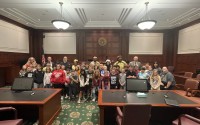 Students from Paddock Road Elementary School pose with actors and legal professionals taking part in the 2025 Law Day mock trial at the Roman Hruska Federal Courthouse in Omaha. 
(Courtesy of Dave Sommers)