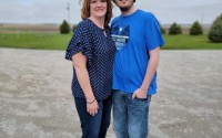 Nick Herringer and his mother Tammy Herringer stand in front of their house northwest of Hastings. Their water, drawn from their privately drilled well, showed a nitrate level of 18 parts per million earlier this year, much higher than the EPA limit of 10 ppm. (Courtesy Photo)
