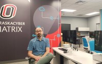 Matt Hale, director of the School of Interdisciplinary Informatics at the University of Nebraska-Omaha, created the MATRIX cyber center, a NASA-style control center that monitors potential cyberattacks at local companies. 
(Tim Trudell / The Daily Record)
