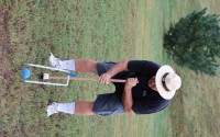 Brian Brigham, who founded the Omaha Croquet Club, watches as a ball rolls through a wicket.
(Tim Trudell / The Daily Record)