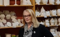 Nancy King, owner of That Pottery Place, showcases the hundreds of ceramic pieces available for customers at her paint-your-own pottery studio in Omaha, now celebrating its 26th year in business.
(Carla Chance / The Daily Record)