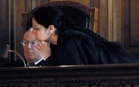 Nebraska Supreme Court justices Edward Hannon and Lindsey Miller-Lerman look over shared evidence during the Hergert impeachment trial in the Nebraska Supreme Court, Thursday, May 11, 2006, in Lincoln, Neb. University of Nebraska Regent David Hergert was called by prosecutors to testify Thursday in his impeachment trial. 
(Robert Becker / The Lincoln Journal Star / AP Photo)