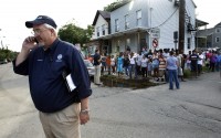 Federal Emergency Management Agency administrator W. Craig Fugate talks on the telephone Wednesday, Aug. 31, 2011, in Paterson, New Jersey.
(Mel Evans / AP Photo)