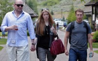 Facebook CEO Mark Zuckerberg (right) walks with Laura Arrillaga-Andreessen (center) wife of Marc Andreessen (left) at the Allen & Company Sun Valley Conference in Sun Valley, Idaho, Wednesday, July 11, 2012. 
(Paul Sakuma / AP Photo)