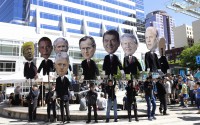 Supporters hold caricatures of U.S. presidents at a rally for a group of young people who filed a lawsuit saying U.S. energy policies are causing climate change and hurting their future. The group faces a major hurdle Tuesday as lawyers for the Trump administration argue to stop the case from moving forward. in Portland, Ore., Tuesday, June 4, 2019. 
(Steve Dipaola / AP Photo)