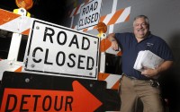 In this Nov. 25, 2019, photo, Dave McMannis, first responder liaison with the Franklin County Engineers office, poses for a photo at the Franklin County Engineers office in Columbus, Ohio. He is responsible for contacting schools, emergency responders and others to coordinate traffic before construction projects start. 
(Eric Albrecht / The Columbus Dispatch via AP)