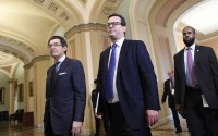 House Democrat attorneys Norm Eisen (left) and Barry Berke (center) arrive on the Senate side of Capitol Hill in Washington, Monday, Feb. 3, 2020, for the impeachment trial of President Donald Trump. 
(Susan Walsh / AP Photo)