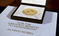 The Nobel diploma and medal in physiology or medicine presented to Charles M. Rice is displayed. (Angela Weiss / AP Photo)