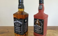 A bottle of Jack Daniel’s Tennessee Whiskey is displayed next to a Bad Spaniels dog toy.
(Jessica Gresko / AP Photo)