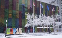 Delegates arrive at the convention center at the COP15 UN conference on biodiversity during a snowfall in Montreal, Friday, Dec. 16, 2022. After a historic biodiversity agreement was reached, countries now face pressure to deliver on the promises. The most significant part of the global biodiversity framework is a commitment to protect 30% of land and water considered important for biodiversity by 2030. (Paul Chiasson / The Canadian Press via AP Photo)