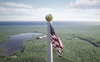 This image from video provided by the Flagpole of Freedom Park in 2022 shows a rendering of a proposed world’s tallest flagpole in Maine. The 10,000-acre plot is in a township overseen by a state agency, neighboring Columbia Falls. (Flagpole of Freedom Park via AP)