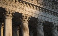 The Supreme Court in Washington is seen at sunset on Oct. 10, 2017. In a monthslong inquiry, which included reviewing tens of thousands of pages of documents from more than 100 public records requests, The Associated Press has examined what happens behind the scenes when Supreme Court justices travel to colleges and universities for lectures and other events. (J. Scott Applewhite / AP Photo)