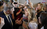 Johnny Ellis (left) argues over gun law reform with Covenant School parent Mary Joyce outside the House chamber after a special session of the state legislature on public safety adjourned Tuesday, Aug. 29, 2023, in Nashville, Tenn. 
(George Walker IV / AP Photo)