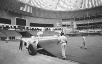 Workers lay AstroTurf at the Astrodome in Houston, July 13, 1966. Artificial turf has come a long way since it was introduced on a grand stage to the sports world at the Astrodome. 
(Ed Kolenovsky / AP Photo)